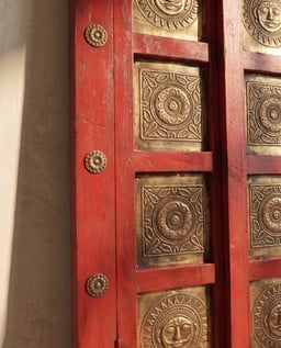 Wooden window brass art in red view